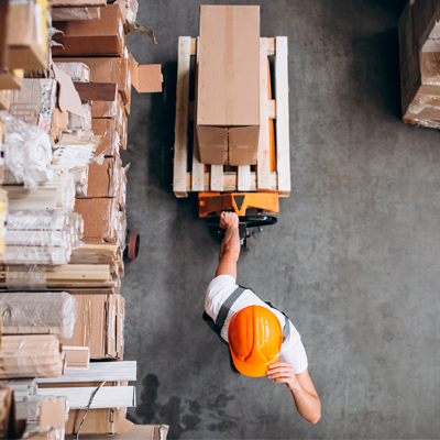 young man working at warehouse with boxes