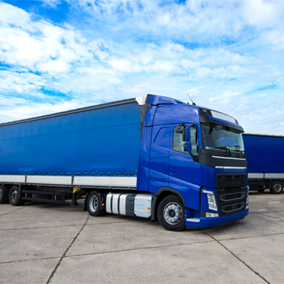 truck vehicle with trailers in background